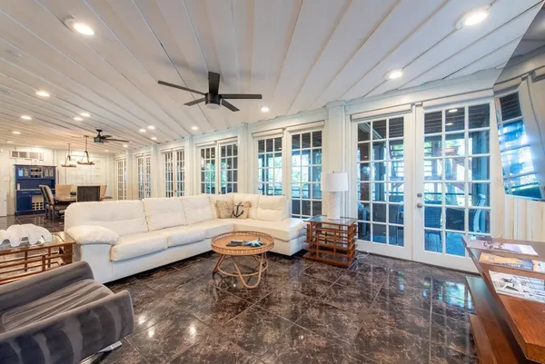 a living room with furniture and a table