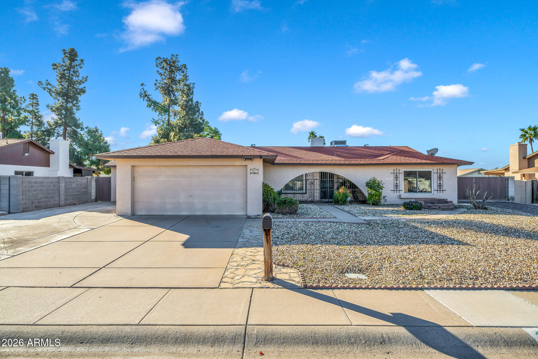 3033 West Kathleen Road Phoenix, AZ 85053 - Photo 1 of 42 a front view of a house with a yard and garage