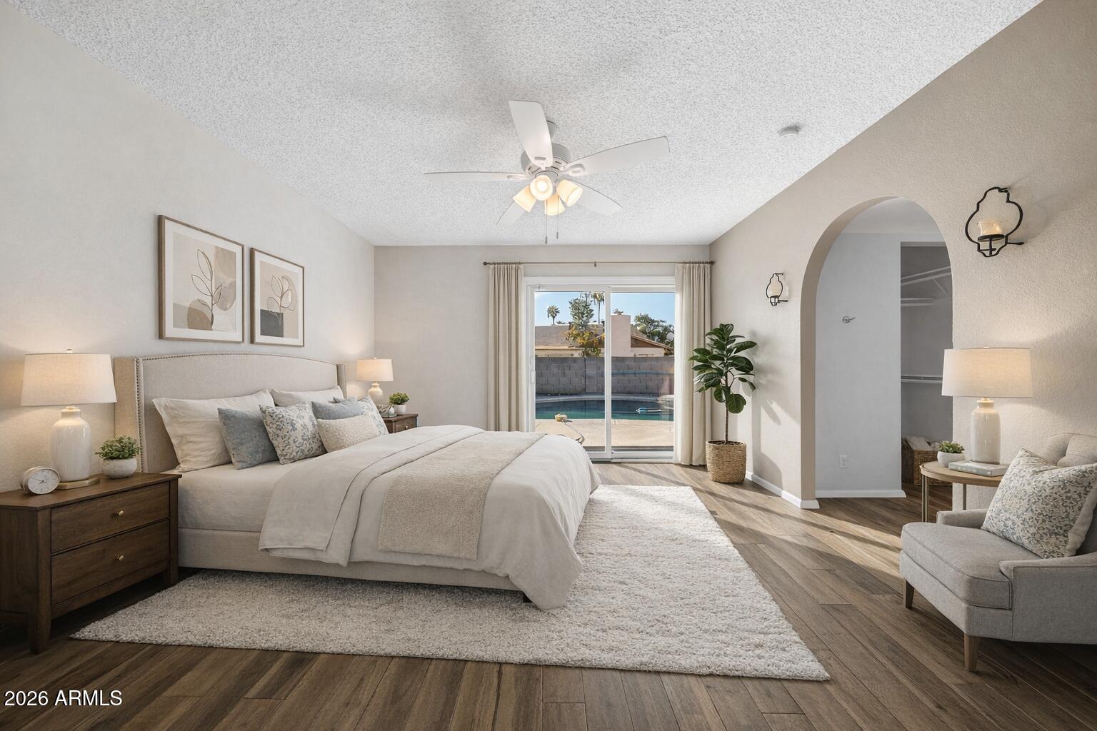 3033 West Kathleen Road Phoenix, AZ 85053 - Photo 16 of 42 a bedroom with a large bed and a large window