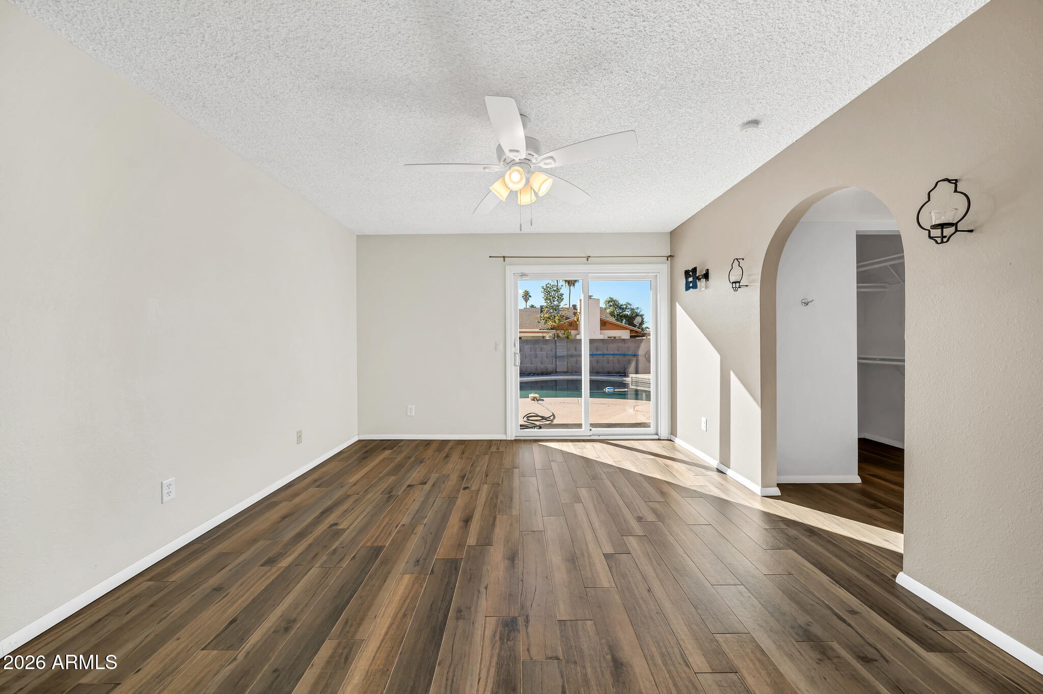 3033 West Kathleen Road Phoenix, AZ 85053 - Photo 17 of 42 wooden floor in an empty room with a window