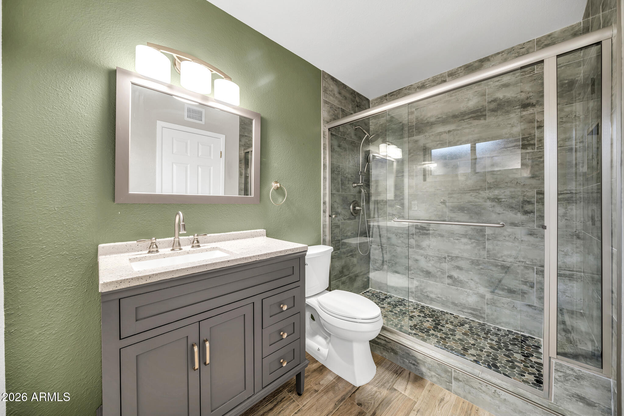 3033 West Kathleen Road Phoenix, AZ 85053 - Photo 22 of 42 a bathroom with a sink a toilet and shower