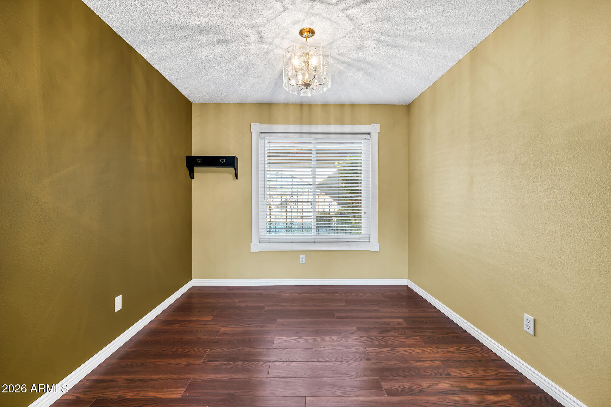 3033 West Kathleen Road Phoenix, AZ 85053 - Photo 26 of 42 a view of empty room with wooden floor and fan