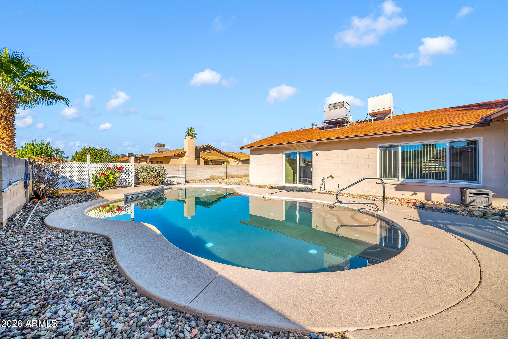 3033 West Kathleen Road Phoenix, AZ 85053 - Photo 28 of 42 a view of a swimming pool with an outdoor seating