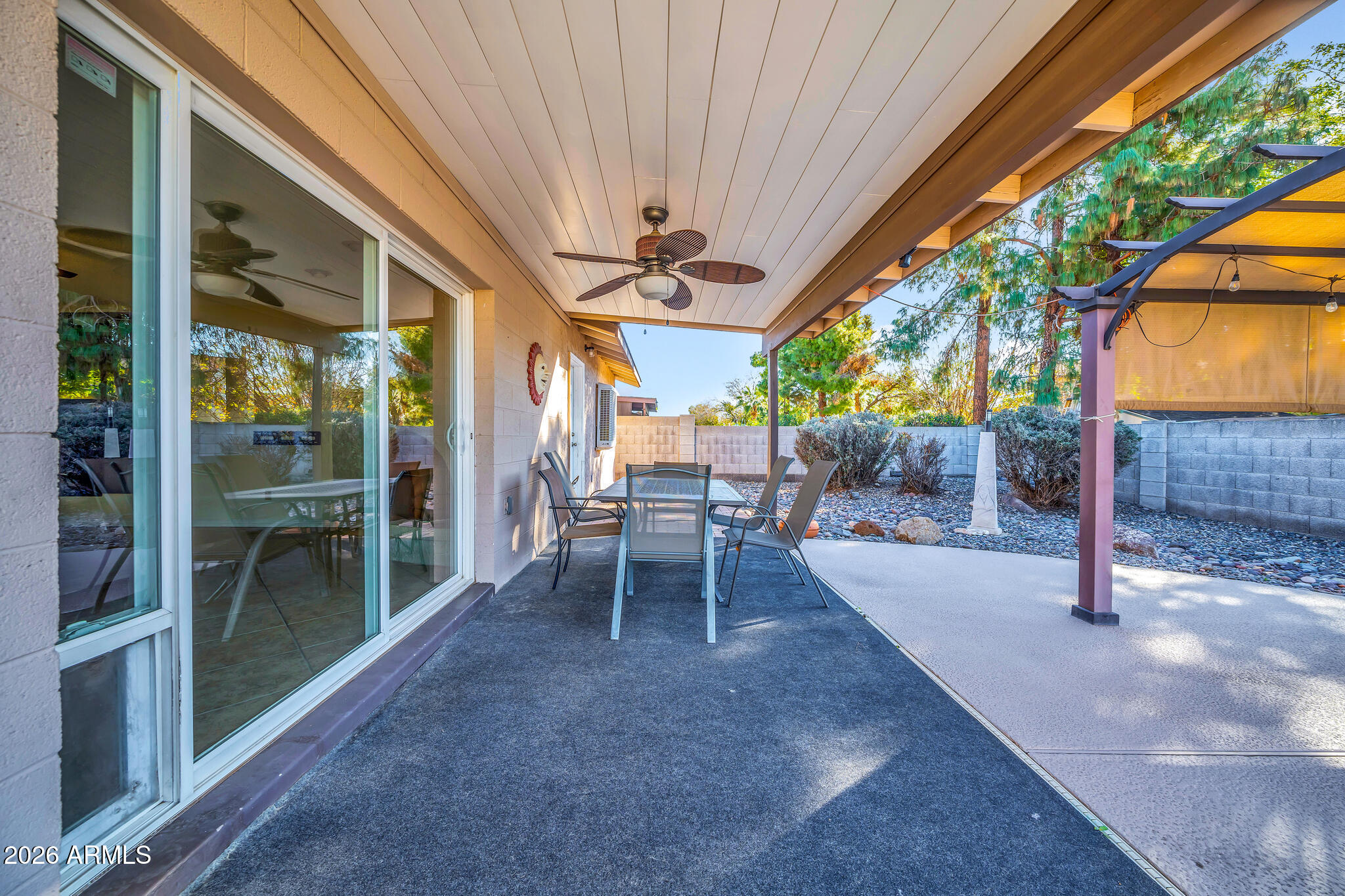 3033 West Kathleen Road Phoenix, AZ 85053 - Photo 36 of 42 a view of a porch with chairs and a backyard