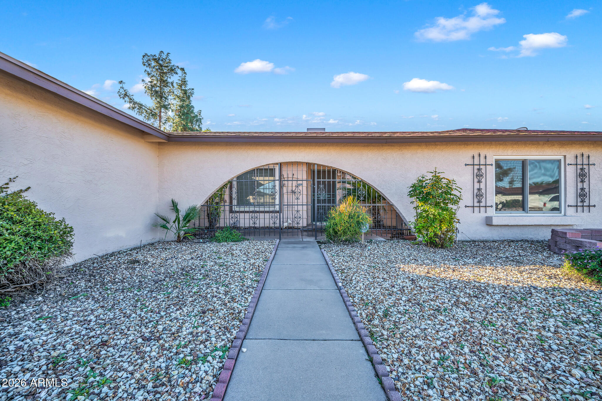 3033 West Kathleen Road Phoenix, AZ 85053 - Photo 3 of 42 a front view of a house with garden