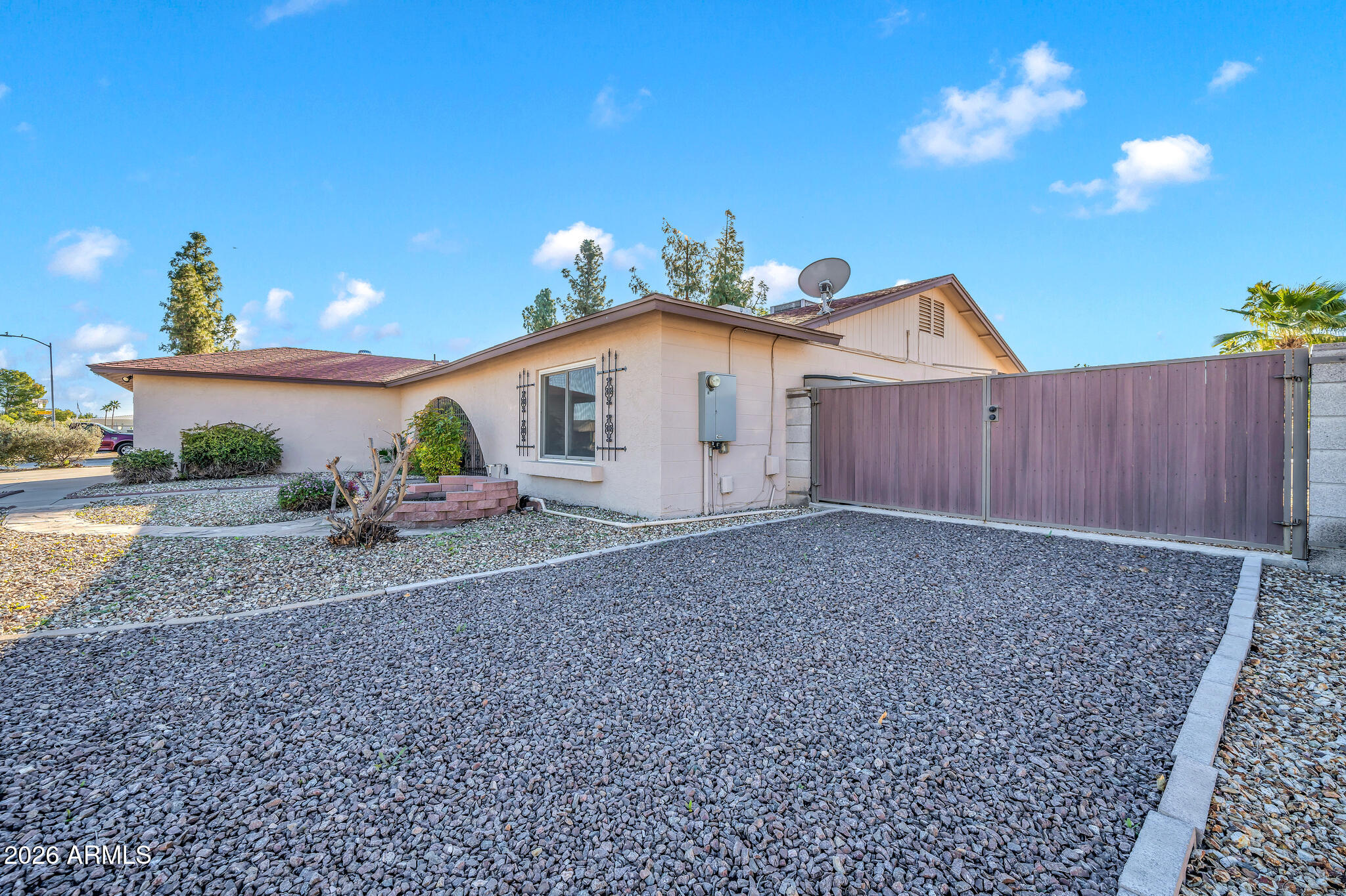 3033 West Kathleen Road Phoenix, AZ 85053 - Photo 4 of 42 a view of a house with a yard and floor to ceiling window