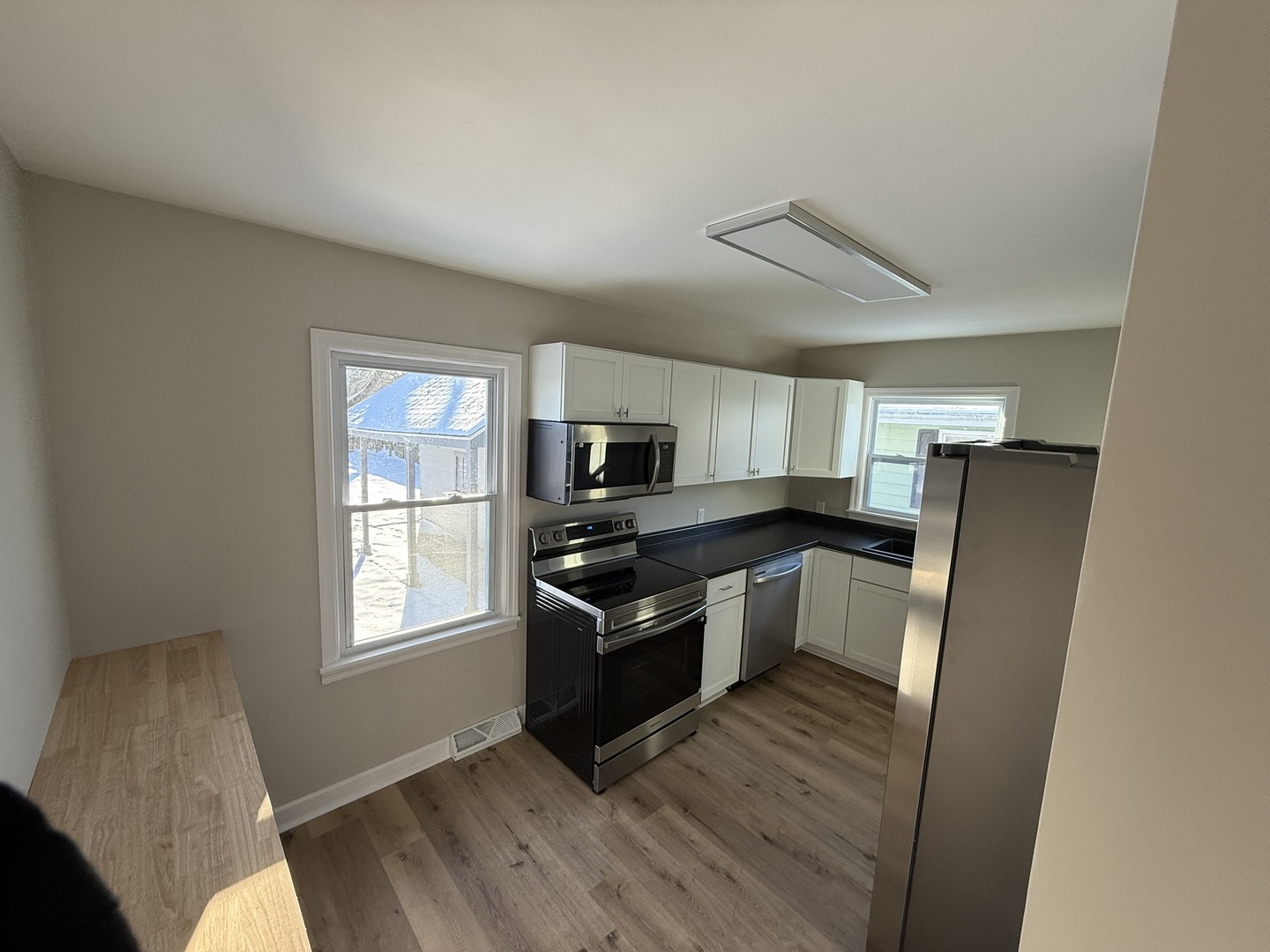 418 East Chestnut Street Paxton, IL 60957 - Photo 5 of 16 a kitchen with stainless steel appliances granite countertop a refrigerator and a stove top oven