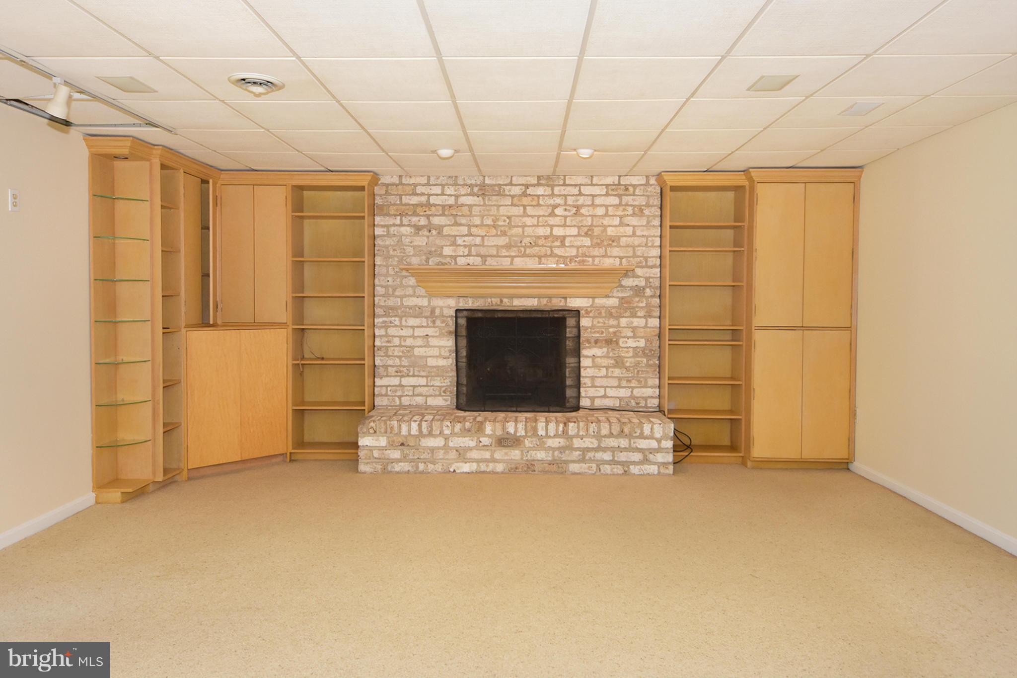 1866 Burley Road Annapolis, MD 21409 - Photo 23 of 26 Family room on lower level has a fireplace