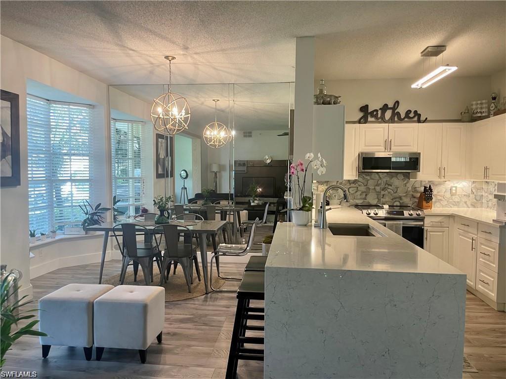 56 Silver Oaks Circle, Unit 102 Naples, FL 34119 - Photo 1 of 12