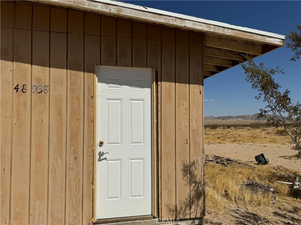 48938 Old Woman Springs Road Johnson Valley, CA 92285 - Photo 7 of 7 a view of wooden door