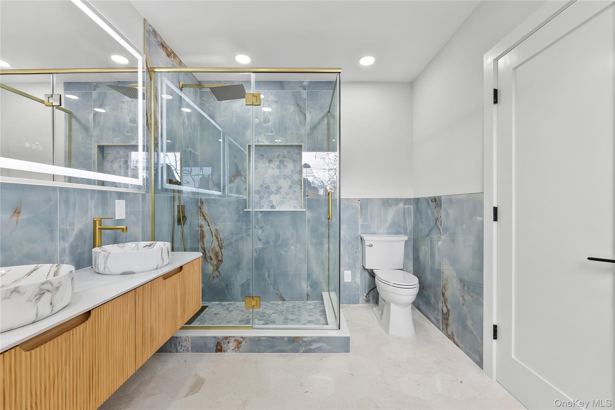 2 Orchid Road Levittown, NY 11756 - Photo 29 of 46 a bathroom with a tub sink mirror and toilet