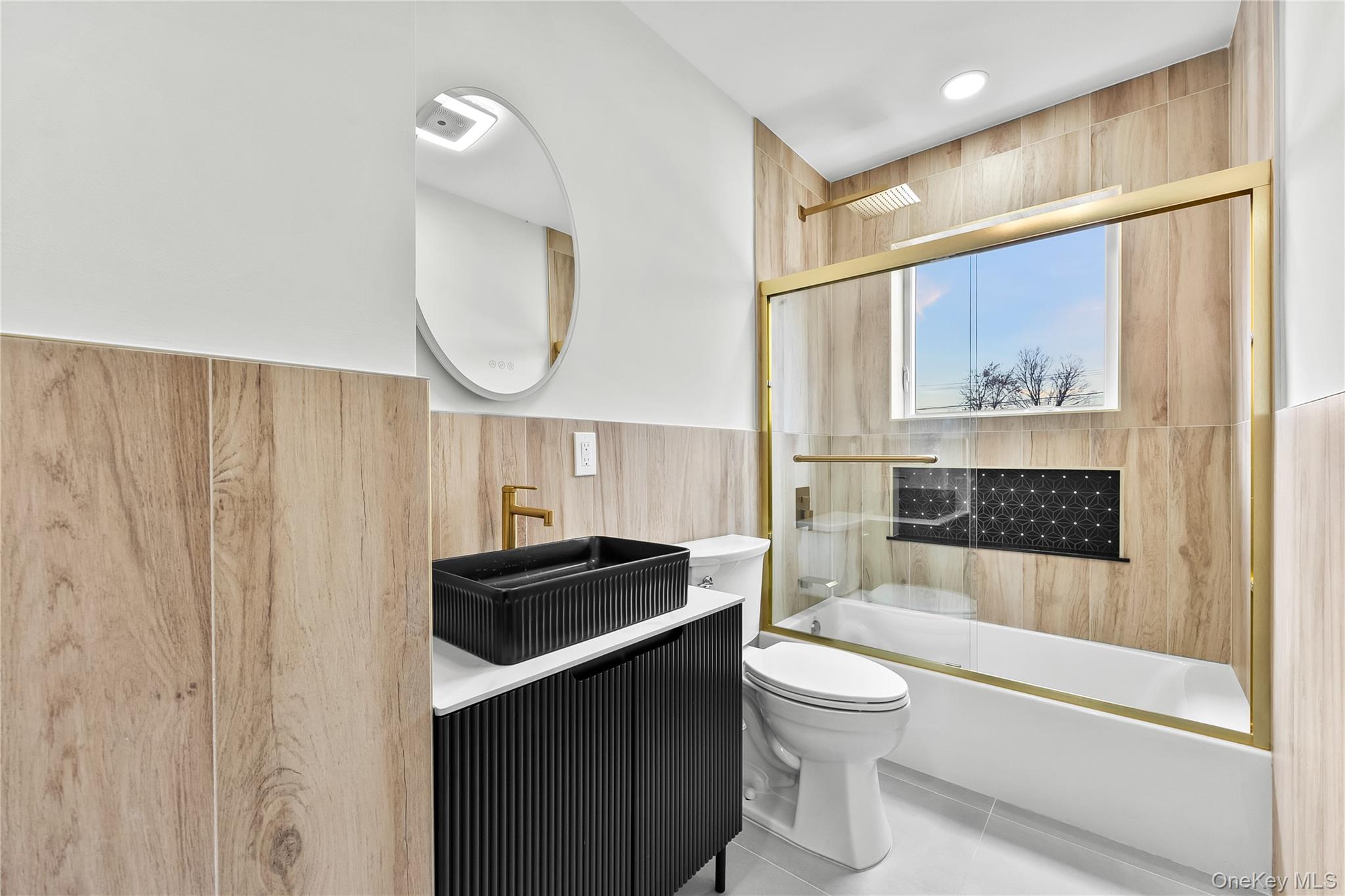 2 Orchid Road Levittown, NY 11756 - Photo 33 of 46 a bathroom with a toilet a sink and a bathtub