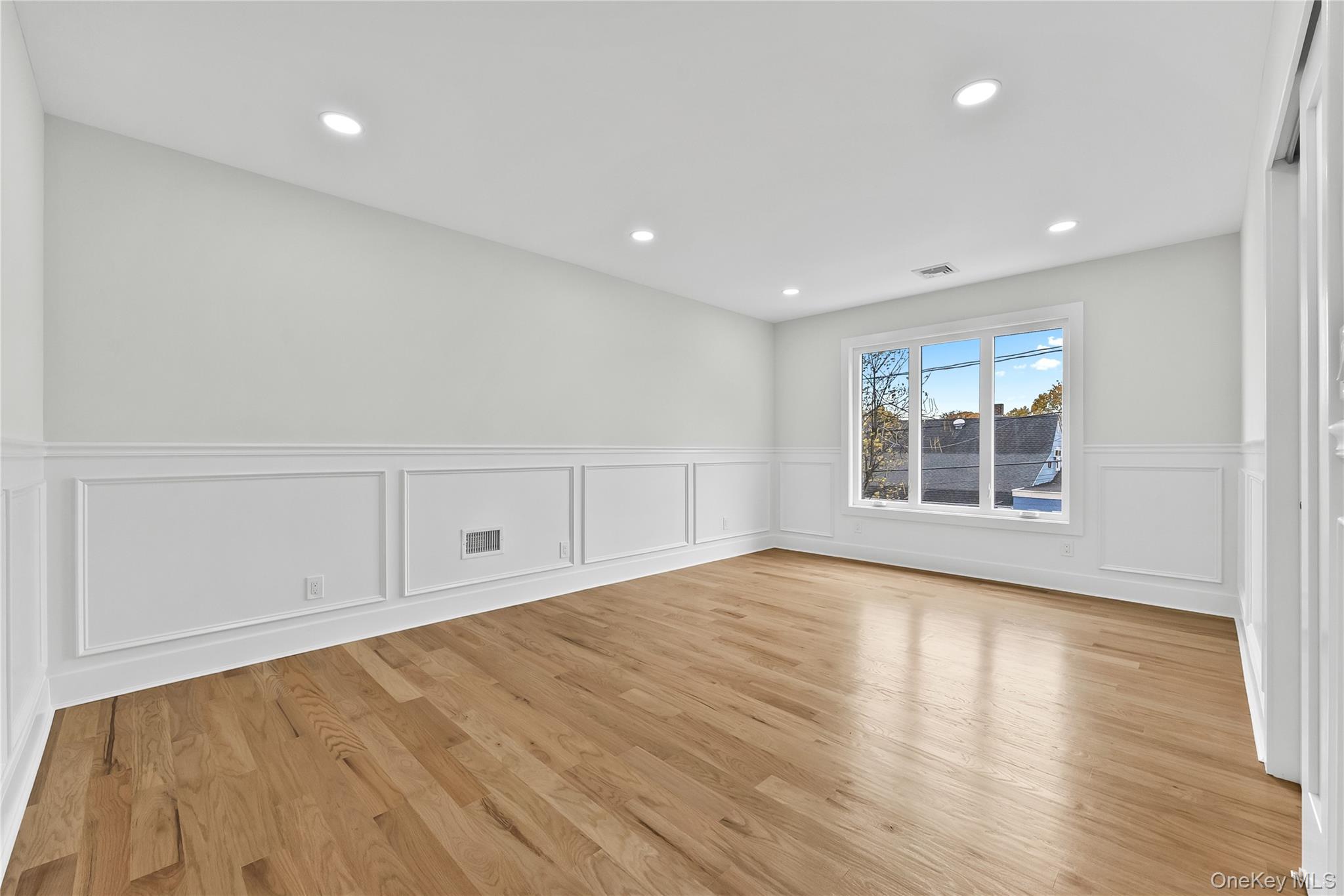 2 Orchid Road Levittown, NY 11756 - Photo 34 of 46 a view of empty room with wooden floor and fan