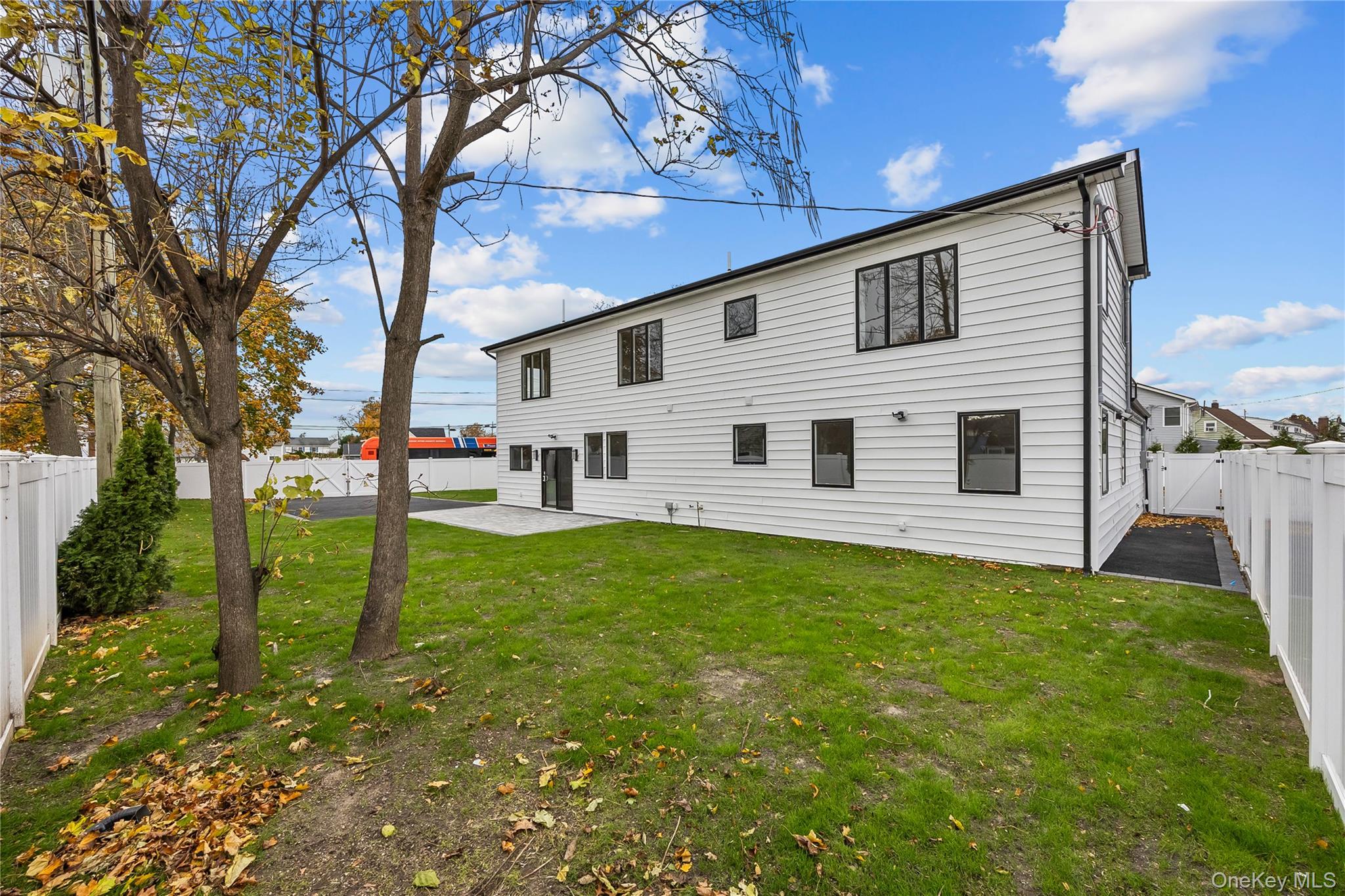 2 Orchid Road Levittown, NY 11756 - Photo 40 of 46 a view of a backyard with large trees