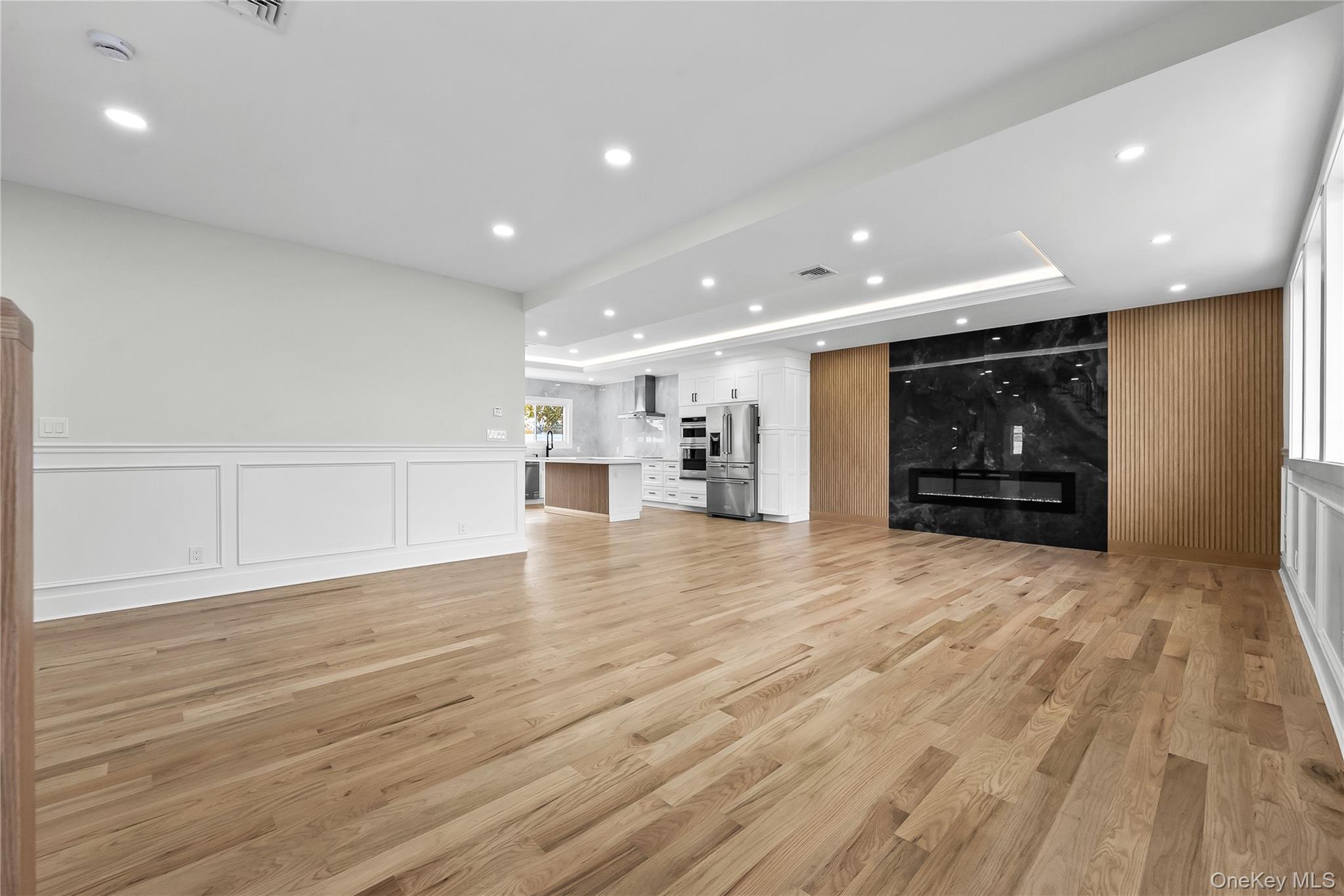 2 Orchid Road Levittown, NY 11756 - Photo 4 of 46 a view of empty room with wooden floor