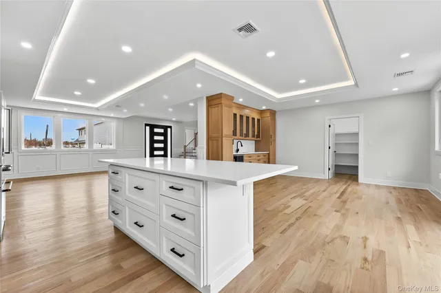 a view of kitchen with cabinets and wooden floor
