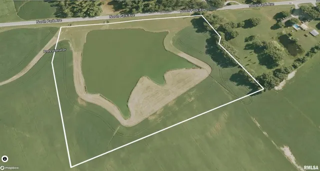 a view of a field with an trees