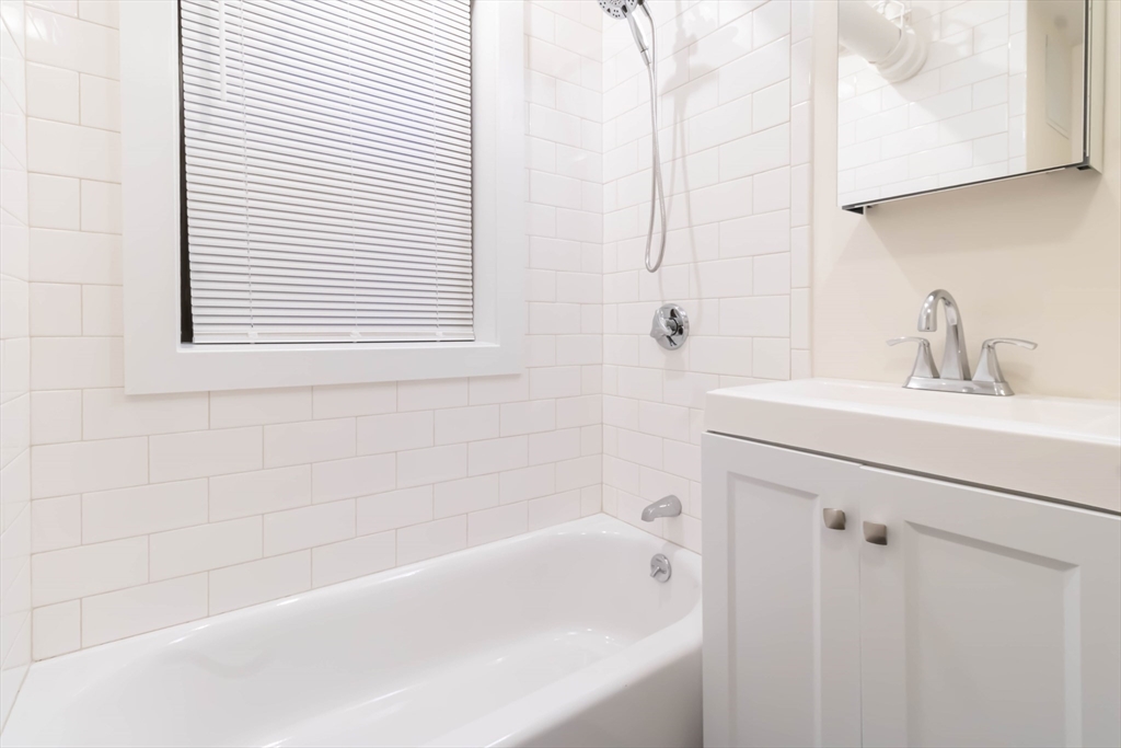 25 Peterborough Street, Unit 31 Boston, MA 02215 - Photo 11 of 14 a bathroom with a sink and a bathtub
