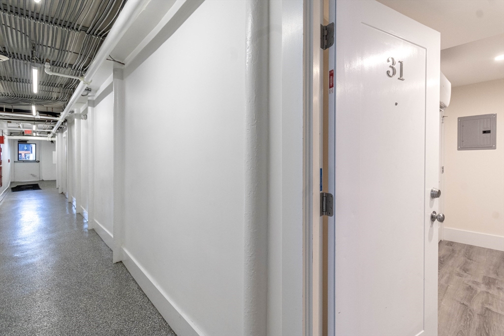 25 Peterborough Street, Unit 31 Boston, MA 02215 - Photo 12 of 14 a view of a hallway with wooden floor