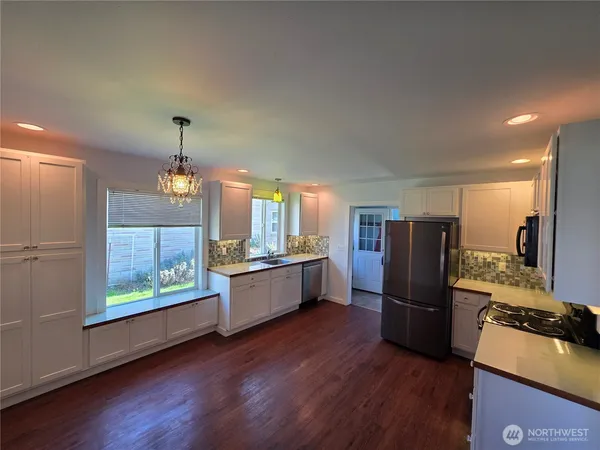 a bathroom with a sink and a window
