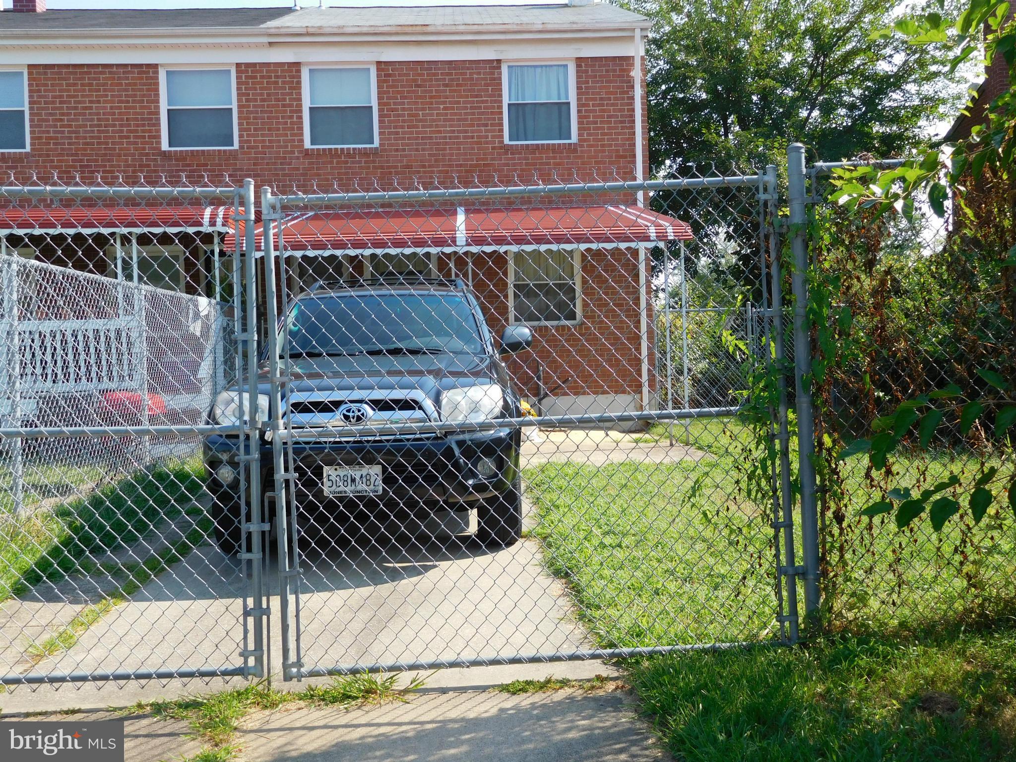 732 Mansfield Road Essex, MD 21221 - Photo 18 of 26 Concrete parking pad in fencing