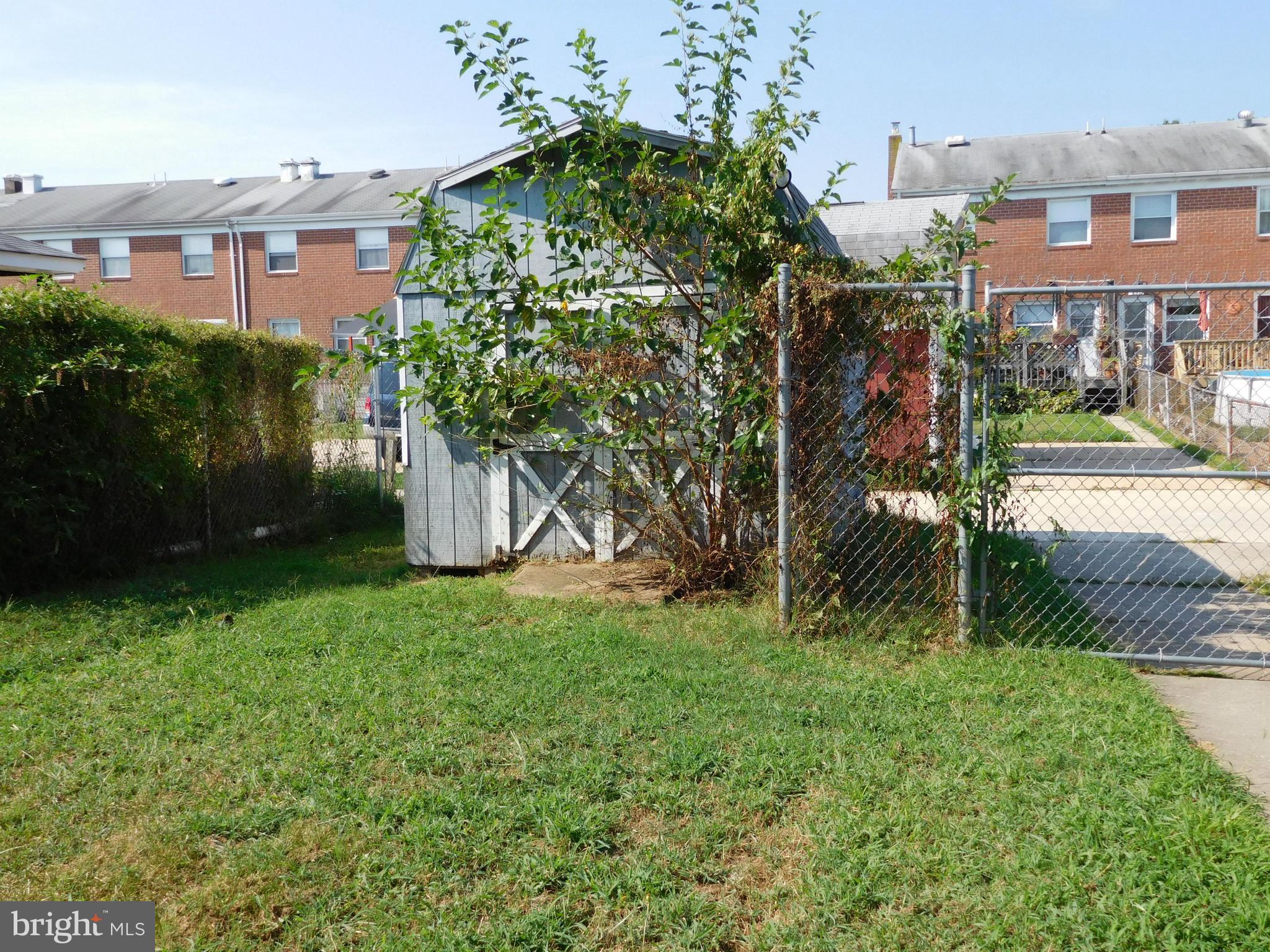 732 Mansfield Road Essex, MD 21221 - Photo 19 of 26 Back yard with high fencing, shed