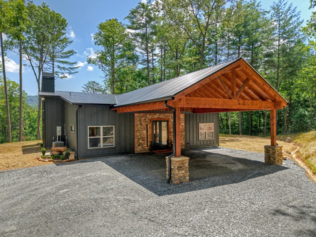 2461 Salem Road Mineral Bluff, GA 30559 - Photo 14 of 86 a front view of a house with garden