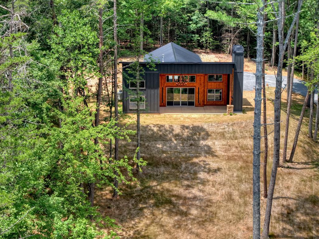 2461 Salem Road Mineral Bluff, GA 30559 - Photo 18 of 86 a view of a table and chairs under an umbrella