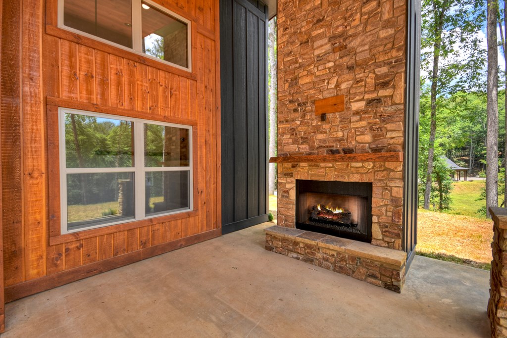 2461 Salem Road Mineral Bluff, GA 30559 - Photo 23 of 86 a view of an empty room with a fireplace and a window