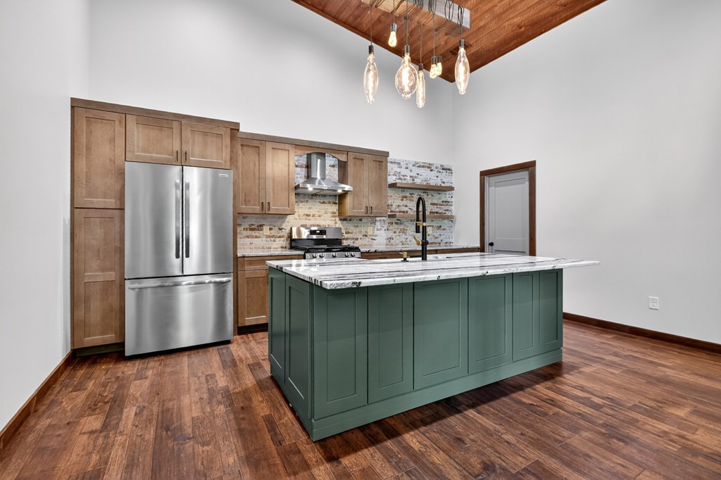 2461 Salem Road Mineral Bluff, GA 30559 - Photo 30 of 86 a kitchen with kitchen island a sink appliances and cabinets