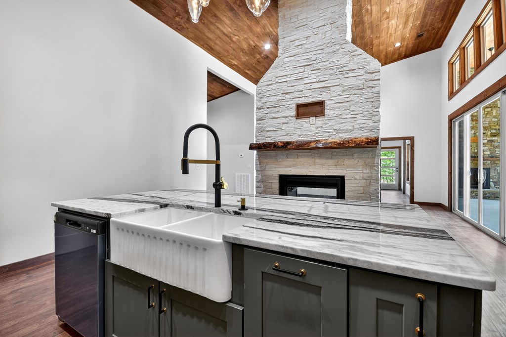 2461 Salem Road Mineral Bluff, GA 30559 - Photo 48 of 86 a view of a kitchen with a sink and a fireplace