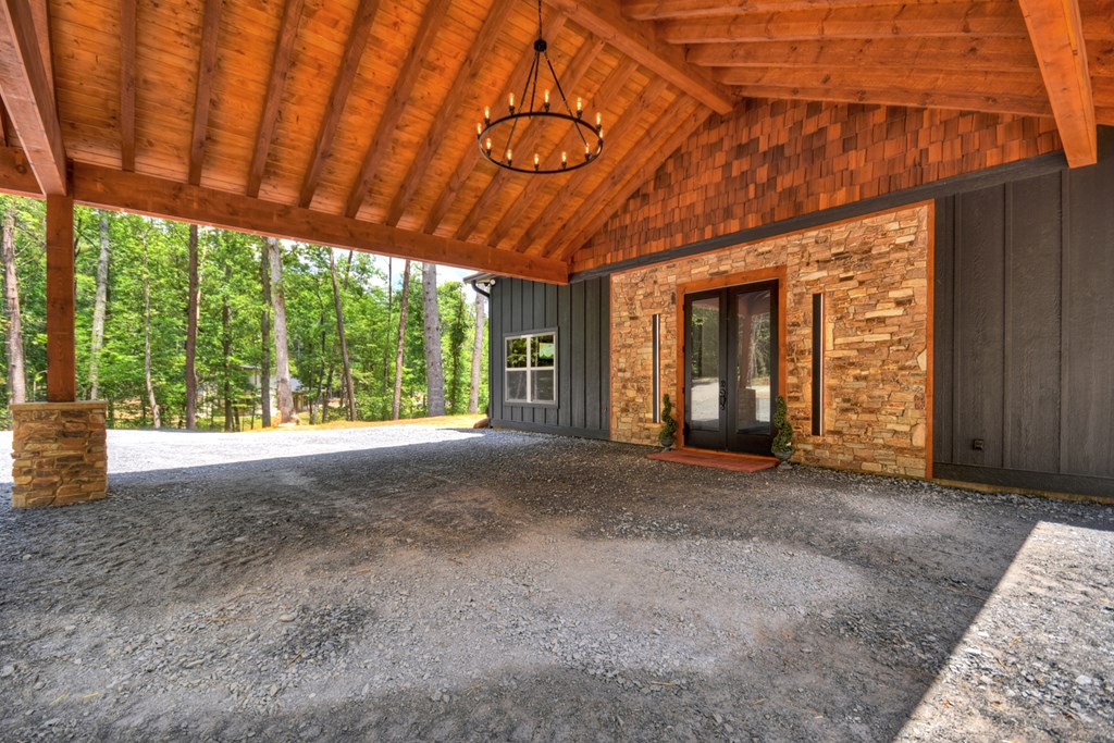 2461 Salem Road Mineral Bluff, GA 30559 - Photo 50 of 86 a view of a room with large windows and wooden roof