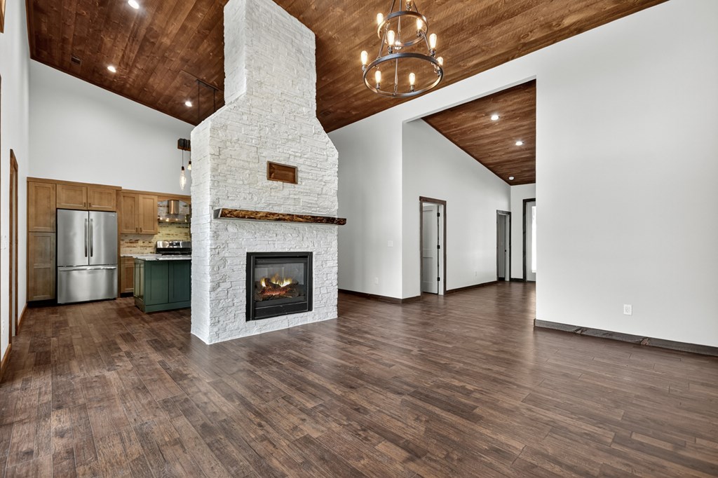 2461 Salem Road Mineral Bluff, GA 30559 - Photo 52 of 86 a view of a livingroom with a fireplace wooden floor and staircase