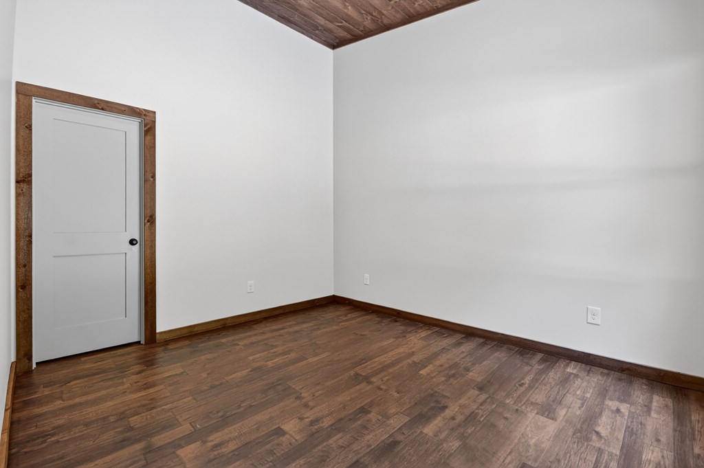 2461 Salem Road Mineral Bluff, GA 30559 - Photo 62 of 86 a view of an empty room with wooden floor and closet