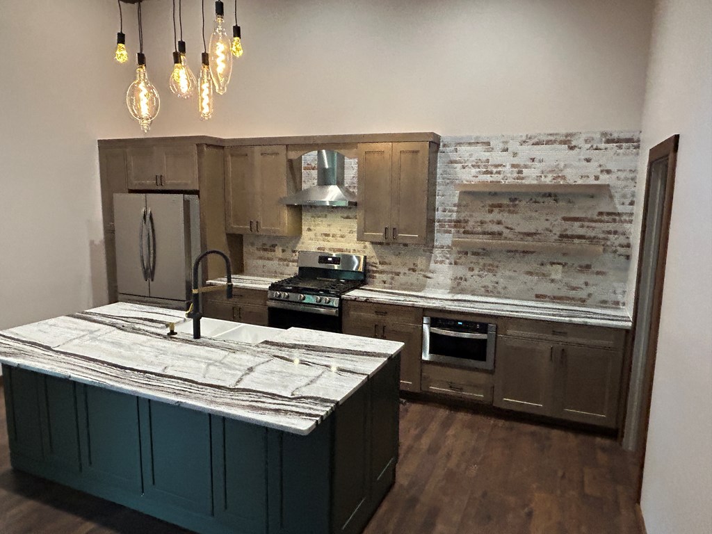 2461 Salem Road Mineral Bluff, GA 30559 - Photo 67 of 86 a kitchen with kitchen island granite countertop a sink cabinets and stainless steel appliances