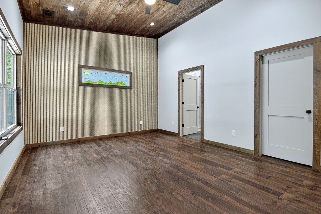 2461 Salem Road Mineral Bluff, GA 30559 - Photo 71 of 86 a view of an empty room with wooden floor and a window