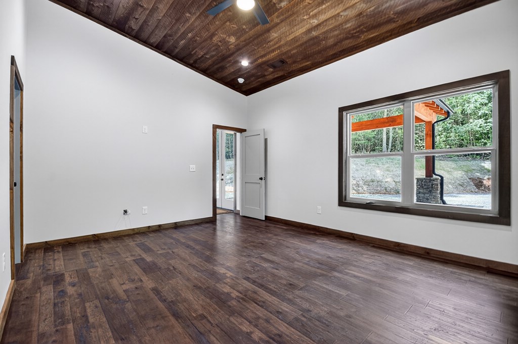 2461 Salem Road Mineral Bluff, GA 30559 - Photo 72 of 86 a view of an empty room with wooden floor and a window