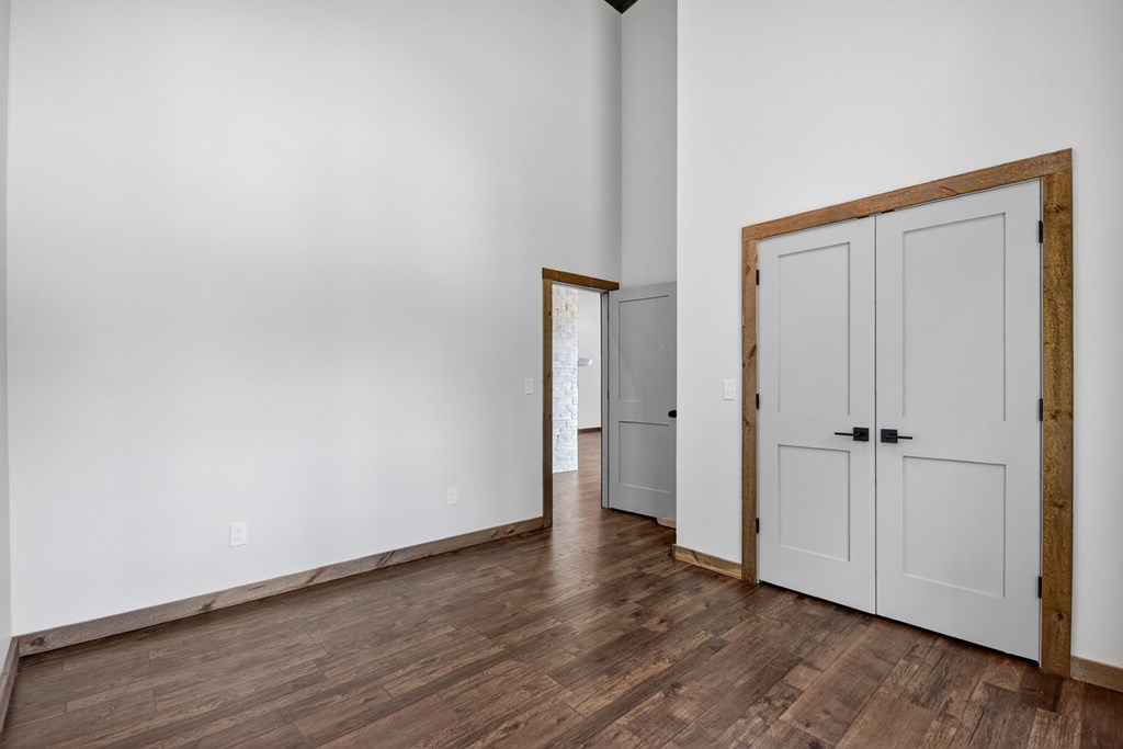 2461 Salem Road Mineral Bluff, GA 30559 - Photo 76 of 86 a view of an empty room with wooden floor and closet