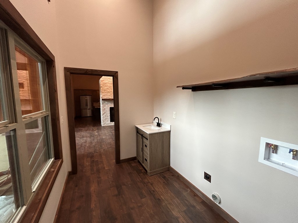 2461 Salem Road Mineral Bluff, GA 30559 - Photo 82 of 86 a view of a hallway with wooden floor and staircase