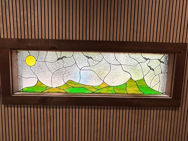 a kitchen with stainless steel appliances granite countertop a sink a stove top oven and a refrigerator