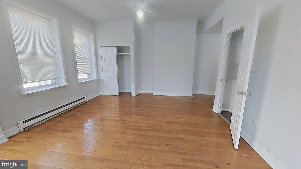 1234-40 Rising Sun Avenue, Unit C Philadelphia, PA 19140 - Photo 5 of 10 a view of empty room with wooden floor