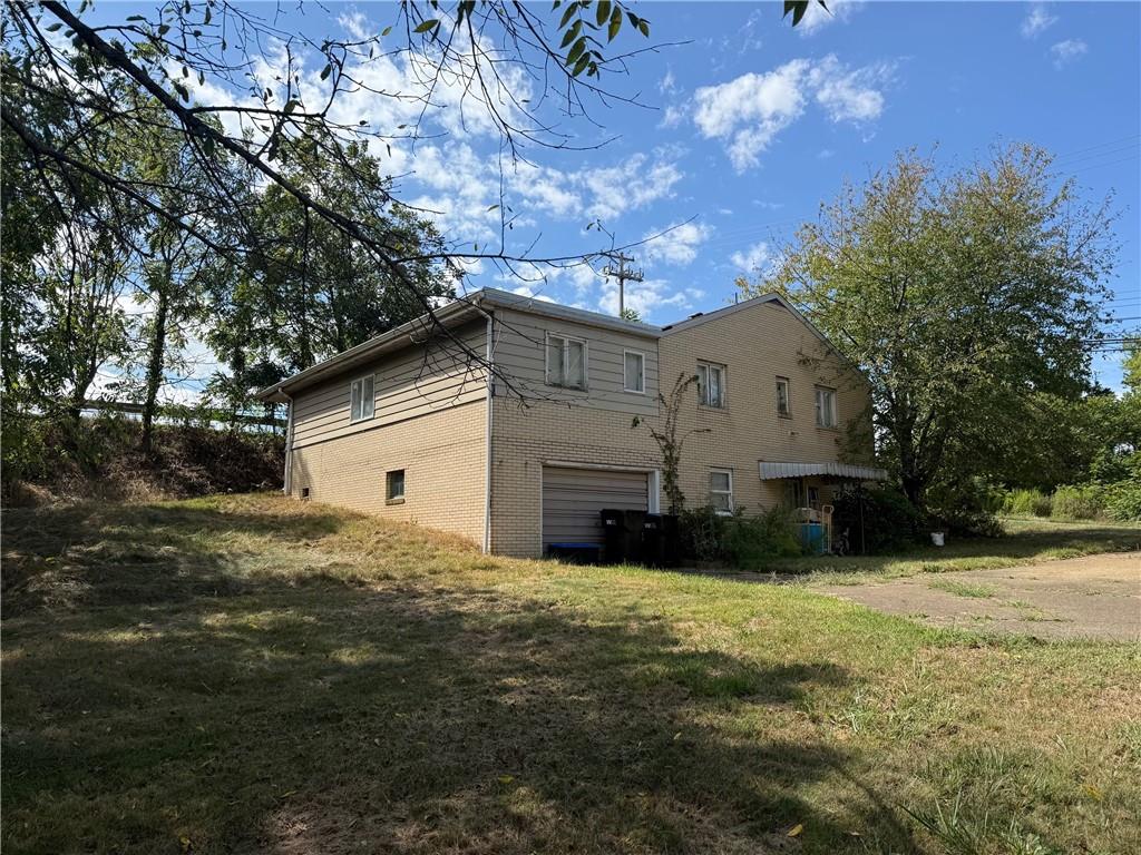 102 Baker Rd Extension Monaca, PA 15061 - Photo 2 of 12 a view of a house with a yard
