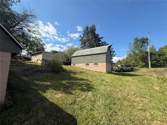 a backyard of a house with lots of green space