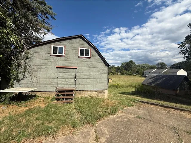 a view of a backyard of the house