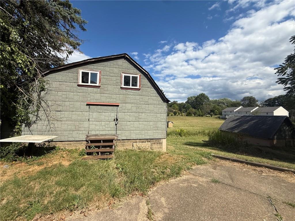 102 Baker Rd Extension Monaca, PA 15061 - Photo 4 of 12 a view of a backyard of the house