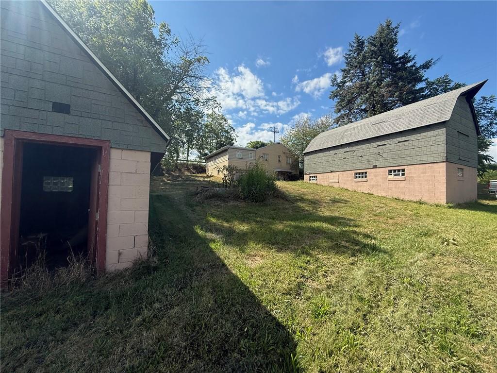 102 Baker Rd Extension Monaca, PA 15061 - Photo 5 of 12 a view of a house with a yard