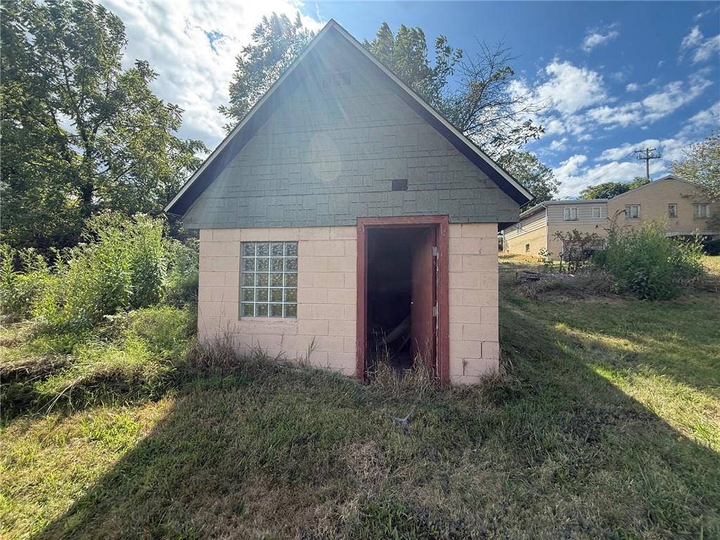 102 Baker Rd Extension Monaca, PA 15061 - Photo 6 of 12 a house view with a backyard space