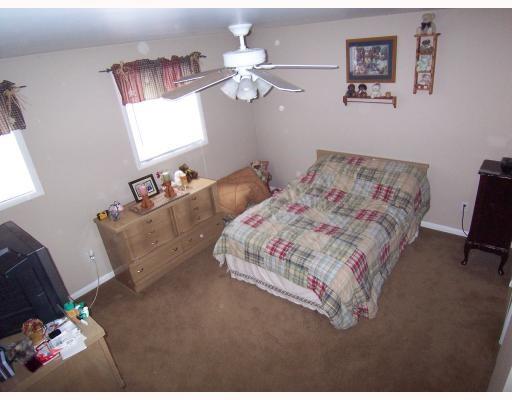 102 Baker Rd Extension Monaca, PA 15061 - Photo 9 of 12 a bedroom with bed and window