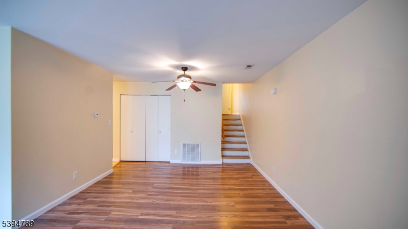 22 Sam Bonnell Drive, Unit 22 Clinton, NJ 08809 - Photo 6 of 16 a view of a hallway with wooden floor