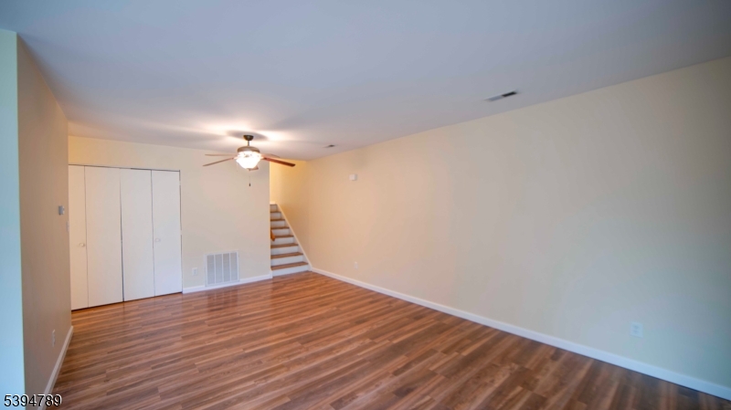 22 Sam Bonnell Drive, Unit 22 Clinton, NJ 08809 - Photo 10 of 16 a view of empty room with wooden floor
